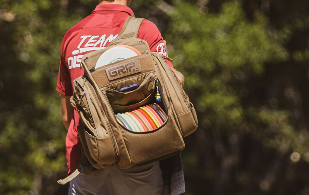 Brown GRIPeq disc golf bag during a round of disc golf