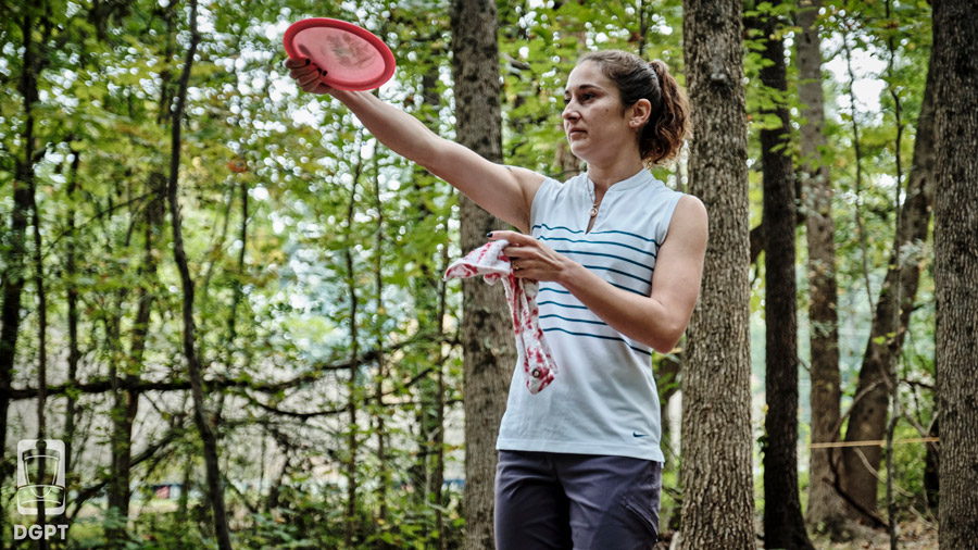 Team GRIPeq member, Jessica Weese, lines up a putt with disc in hand.