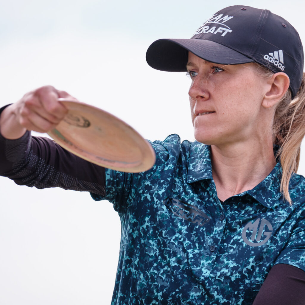 Team GRIPeq member Missy Gannon looks intently off screen with a disc in hand as she prepares a backhand throw.