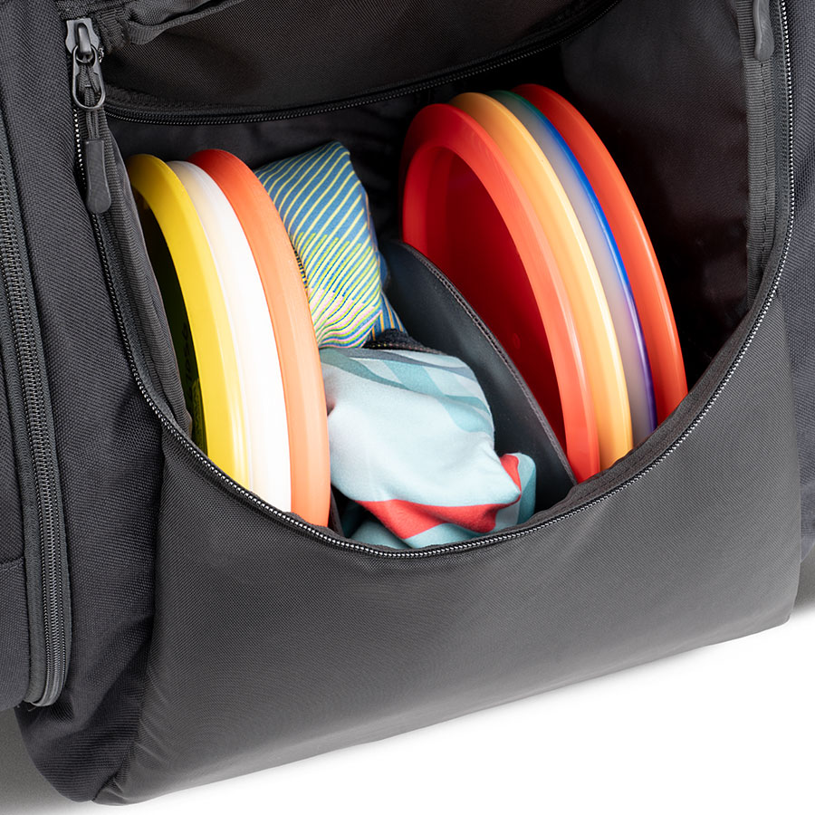 A large disc divider in a GRIPeq bag with discs and a towel in the compartments.