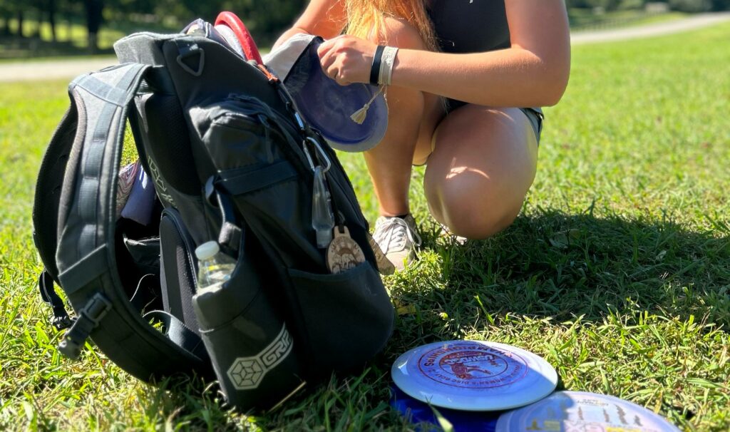 Disc golf player using a high-end GRIPeq disc golf bag