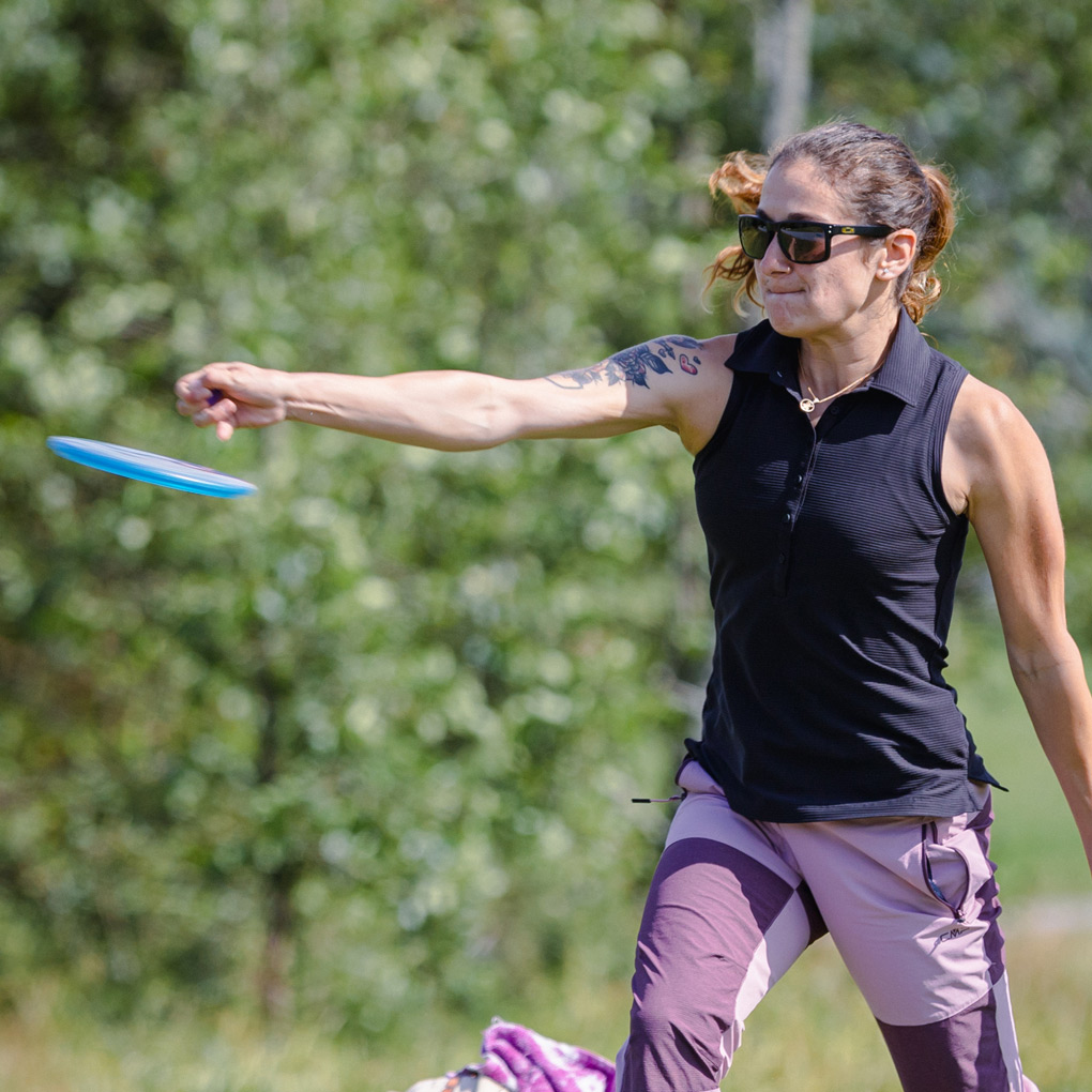 Team GRIPeq member Jessica Weese right as she releases a disc.