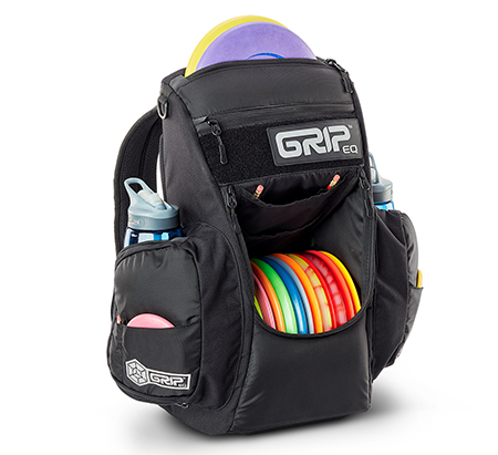 A black GRIPeq CS2 disc golf bag with the front pocket open and loaded with discs.